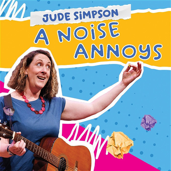 Bright coloured image of female performer with guitar and quirky smile, holding her arm in the air whilst singing.